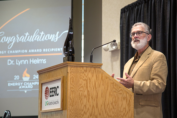 Lynn Helms speaking at a podium